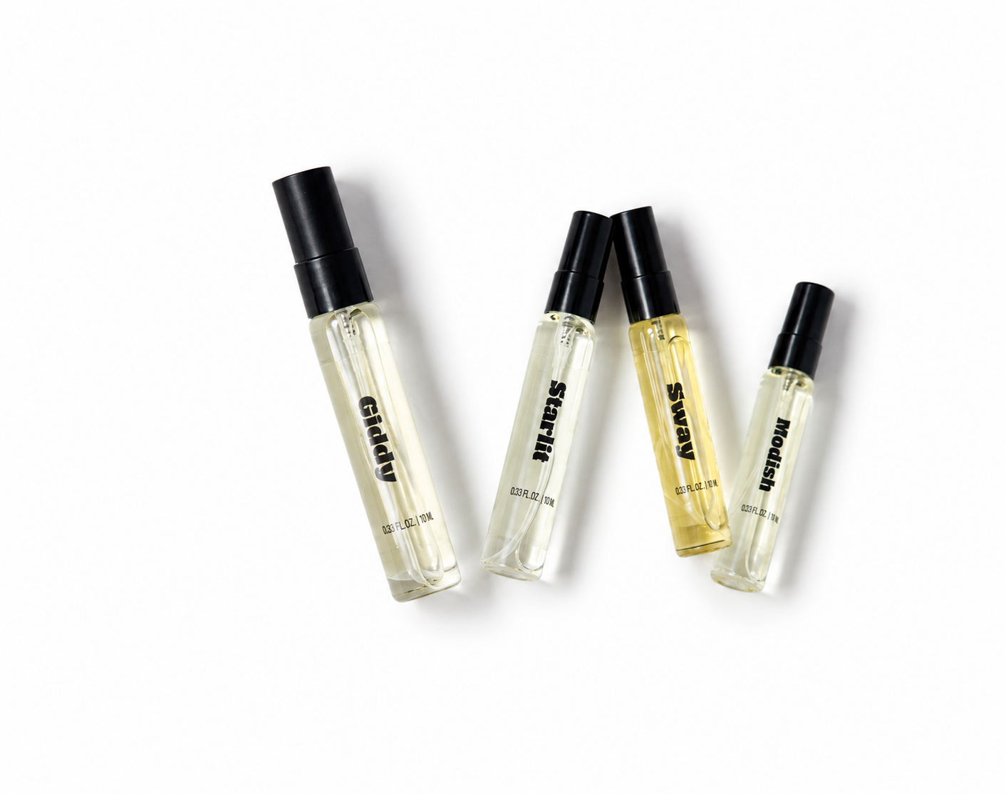 Four clear glass perfume sample vials with black caps arranged diagonally on a white background. Three vials contain clear liquid and one contains a pale yellow liquid.