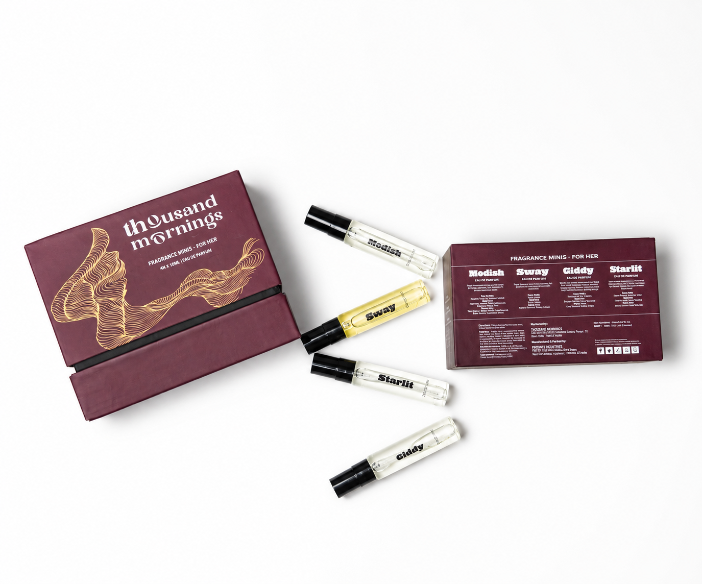 A fragrance gift set on a white background, featuring a burgundy box labeled 'thousand mornings' with gold abstract line art, four clear sample spray vials with black caps, and a smaller matching product box showing fragrance notes.